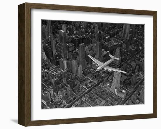 Aerial View of a DC-4 Passenger Plane Flying over Midtown Manhattan-Margaret Bourke-White-Framed Photographic Print