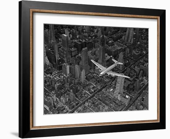 Aerial View of a DC-4 Passenger Plane Flying over Midtown Manhattan-Margaret Bourke-White-Framed Photographic Print