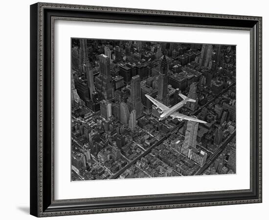 Aerial View of a DC-4 Passenger Plane Flying over Midtown Manhattan-Margaret Bourke-White-Framed Photographic Print