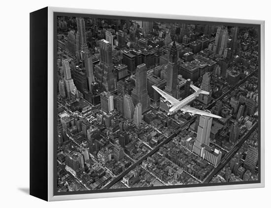 Aerial View of a Dc-4 Passenger Plane in Flight over Manhattan-Margaret Bourke-White-Framed Premier Image Canvas