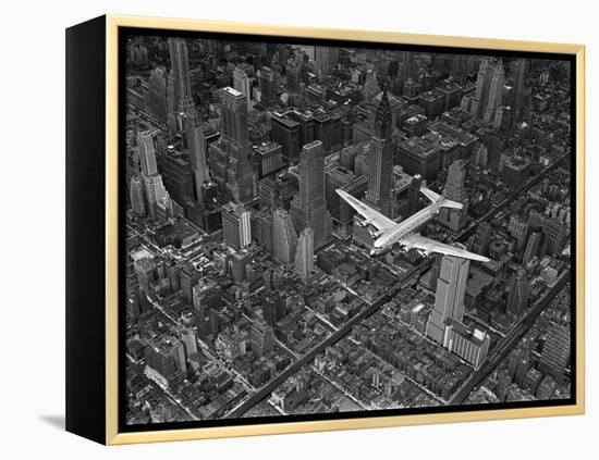 Aerial View of a Dc-4 Passenger Plane in Flight over Manhattan-Margaret Bourke-White-Framed Premier Image Canvas