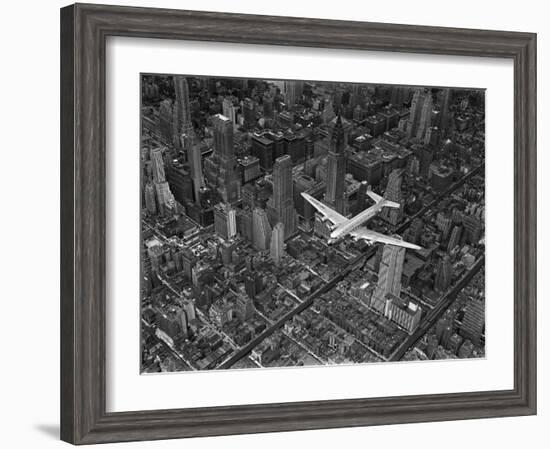 Aerial View of a Dc-4 Passenger Plane in Flight over Manhattan-Margaret Bourke-White-Framed Premium Photographic Print