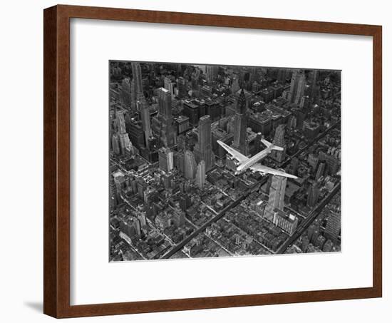 Aerial View of a Dc-4 Passenger Plane in Flight over Manhattan-Margaret Bourke-White-Framed Premium Photographic Print