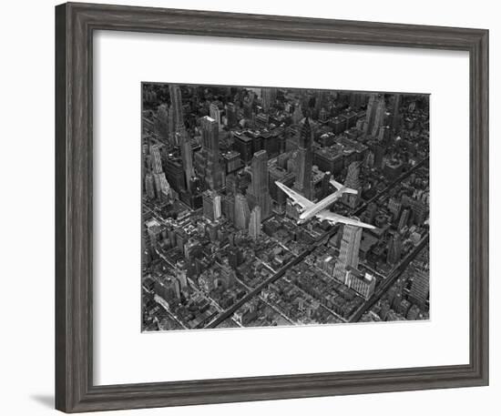 Aerial View of a Dc-4 Passenger Plane in Flight over Manhattan-Margaret Bourke-White-Framed Premium Photographic Print