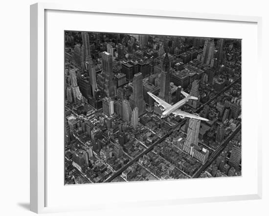 Aerial View of a Dc-4 Passenger Plane in Flight over Manhattan-Margaret Bourke-White-Framed Premium Photographic Print