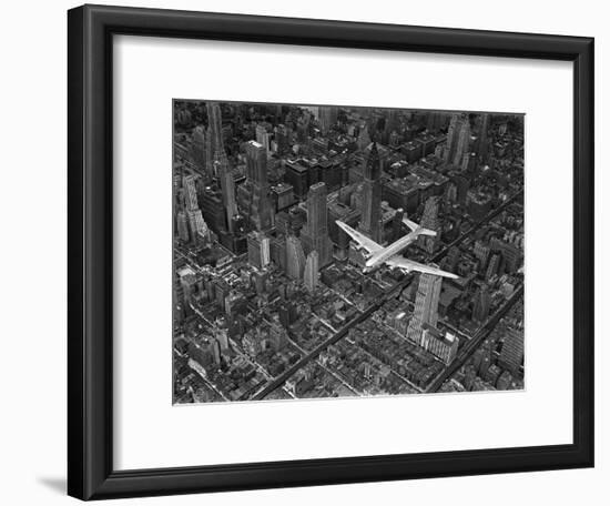 Aerial View of a Dc-4 Passenger Plane in Flight over Manhattan-Margaret Bourke-White-Framed Photographic Print