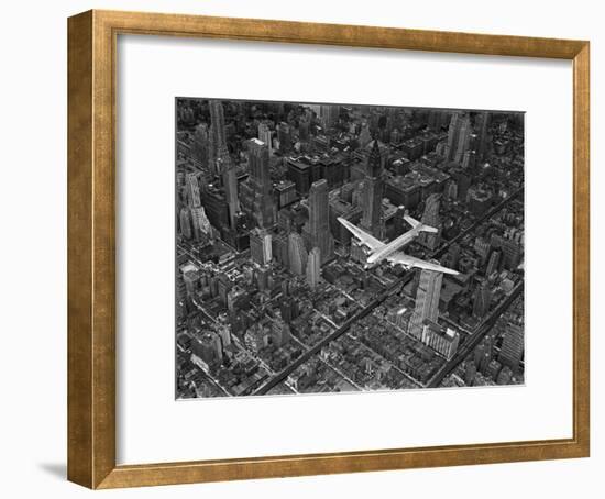 Aerial View of a Dc-4 Passenger Plane in Flight over Manhattan-Margaret Bourke-White-Framed Photographic Print