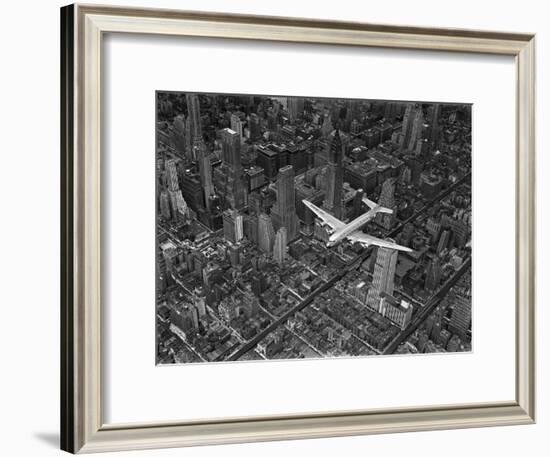 Aerial View of a Dc-4 Passenger Plane in Flight over Manhattan-Margaret Bourke-White-Framed Photographic Print