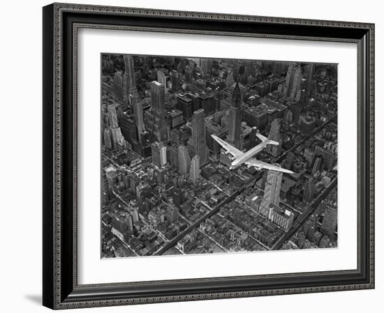 Aerial View of a Dc-4 Passenger Plane in Flight over Manhattan-Margaret Bourke-White-Framed Photographic Print