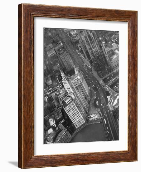 Aerial View of Buildings and a Bridge Crossing a River Flowing Through the City-Margaret Bourke-White-Framed Photographic Print