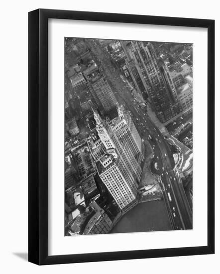 Aerial View of Buildings and a Bridge Crossing a River Flowing Through the City-Margaret Bourke-White-Framed Photographic Print
