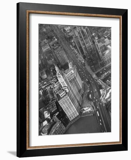 Aerial View of Buildings and a Bridge Crossing a River Flowing Through the City-Margaret Bourke-White-Framed Photographic Print