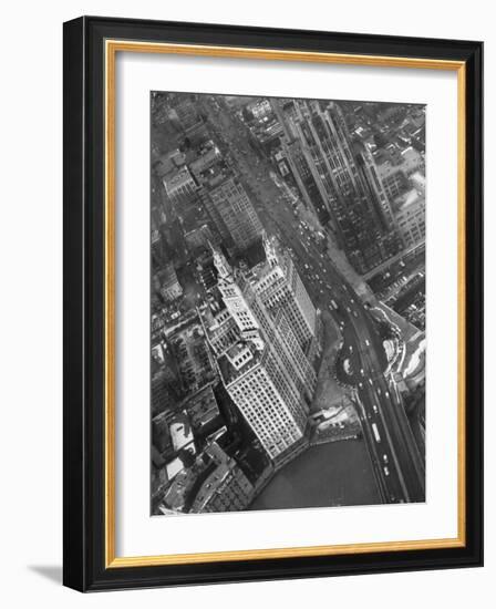 Aerial View of Buildings and a Bridge Crossing a River Flowing Through the City-Margaret Bourke-White-Framed Photographic Print