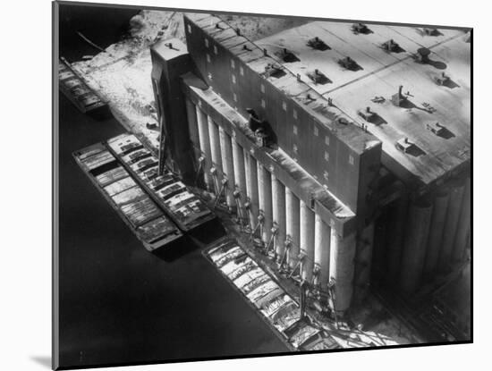 Aerial View of Cargill Grain Elevator with Barges Lined up on the Bank of the Chicago River-Margaret Bourke-White-Mounted Photographic Print