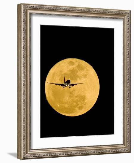 Aeroplane Silhouetted Against a Full Moon-David Nunuk-Framed Photographic Print