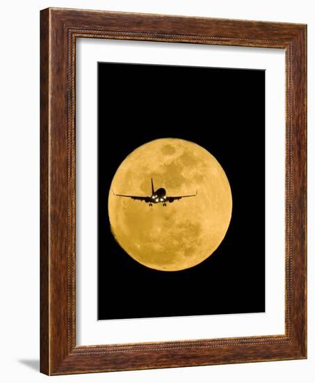 Aeroplane Silhouetted Against a Full Moon-David Nunuk-Framed Photographic Print