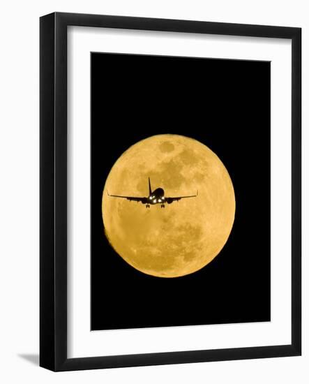 Aeroplane Silhouetted Against a Full Moon-David Nunuk-Framed Photographic Print