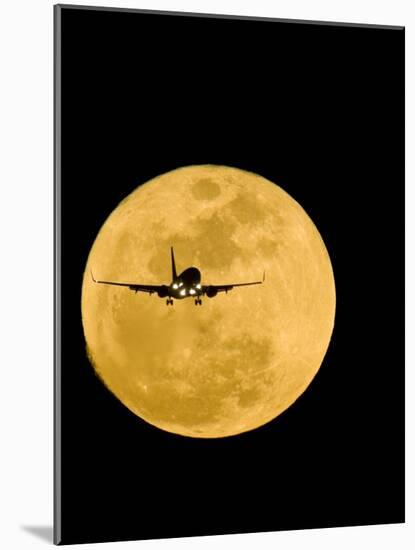 Aeroplane Silhouetted Against a Full Moon-David Nunuk-Mounted Photographic Print