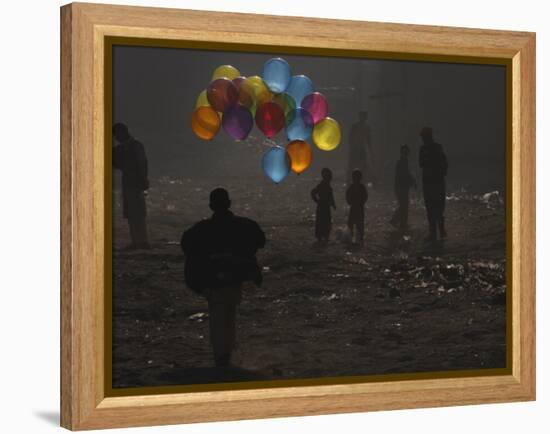 Afghan Boy Runs with Balloons to Join His Friends in Dusty Alley in Kabul, Afghanistan-null-Framed Premier Image Canvas