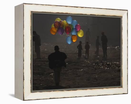 Afghan Boy Runs with Balloons to Join His Friends in Dusty Alley in Kabul, Afghanistan-null-Framed Premier Image Canvas