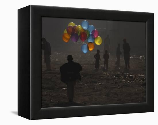 Afghan Boy Runs with Balloons to Join His Friends in Dusty Alley in Kabul, Afghanistan-null-Framed Premier Image Canvas