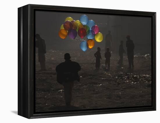 Afghan Boy Runs with Balloons to Join His Friends in Dusty Alley in Kabul, Afghanistan-null-Framed Premier Image Canvas