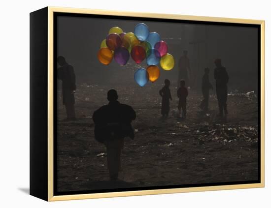 Afghan Boy Runs with Balloons to Join His Friends in Dusty Alley in Kabul, Afghanistan-null-Framed Premier Image Canvas