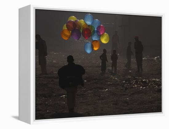 Afghan Boy Runs with Balloons to Join His Friends in Dusty Alley in Kabul, Afghanistan-null-Framed Premier Image Canvas