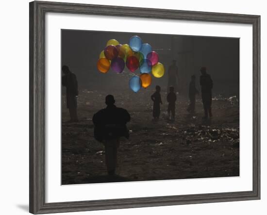 Afghan Boy Runs with Balloons to Join His Friends in Dusty Alley in Kabul, Afghanistan-null-Framed Photographic Print