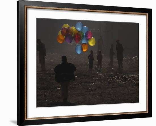 Afghan Boy Runs with Balloons to Join His Friends in Dusty Alley in Kabul, Afghanistan-null-Framed Photographic Print