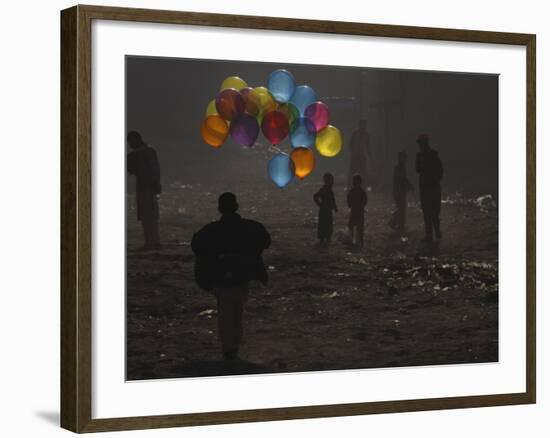 Afghan Boy Runs with Balloons to Join His Friends in Dusty Alley in Kabul, Afghanistan-null-Framed Photographic Print