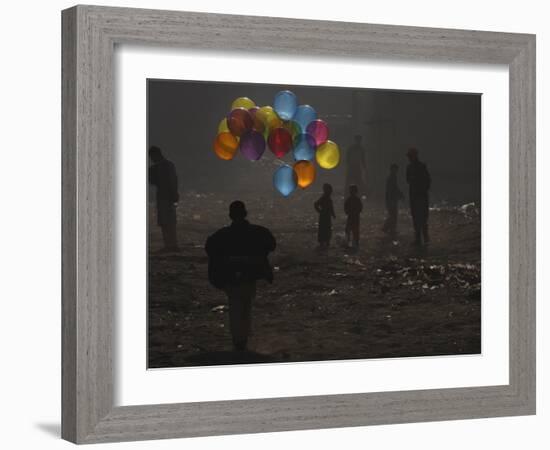 Afghan Boy Runs with Balloons to Join His Friends in Dusty Alley in Kabul, Afghanistan-null-Framed Photographic Print