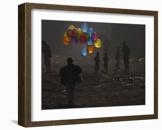 Afghan Boy Runs with Balloons to Join His Friends in Dusty Alley in Kabul, Afghanistan-null-Framed Photographic Print