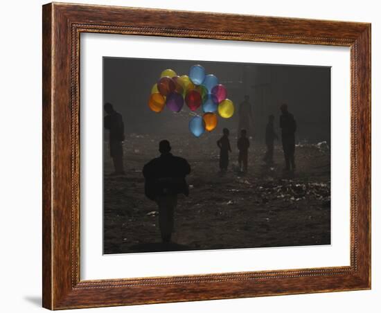 Afghan Boy Runs with Balloons to Join His Friends in Dusty Alley in Kabul, Afghanistan-null-Framed Photographic Print