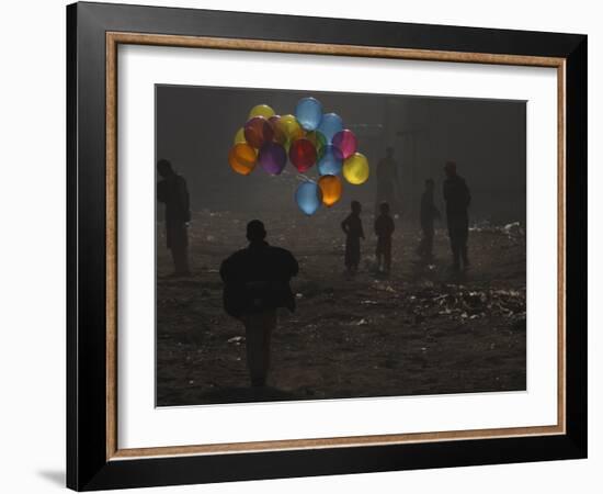 Afghan Boy Runs with Balloons to Join His Friends in Dusty Alley in Kabul, Afghanistan-null-Framed Photographic Print