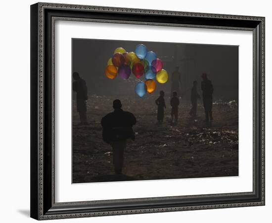 Afghan Boy Runs with Balloons to Join His Friends in Dusty Alley in Kabul, Afghanistan-null-Framed Photographic Print