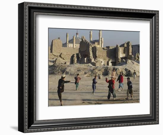 Afghan Boys Play Soccer Near a Mosque and Ruined Buildings During the Early Morning-null-Framed Photographic Print