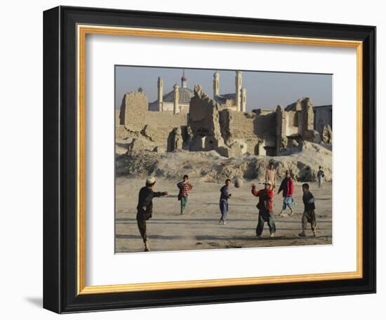 Afghan Boys Play Soccer Near a Mosque and Ruined Buildings During the Early Morning-null-Framed Photographic Print