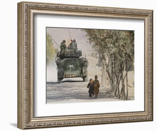 Afghan Boys Walk Along a Path While International Security Assistance Force (Isaf)-null-Framed Photographic Print