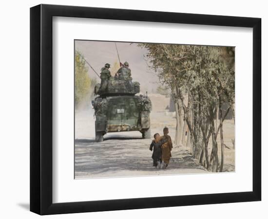 Afghan Boys Walk Along a Path While International Security Assistance Force (Isaf)-null-Framed Photographic Print