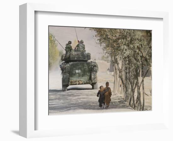 Afghan Boys Walk Along a Path While International Security Assistance Force (Isaf)-null-Framed Photographic Print