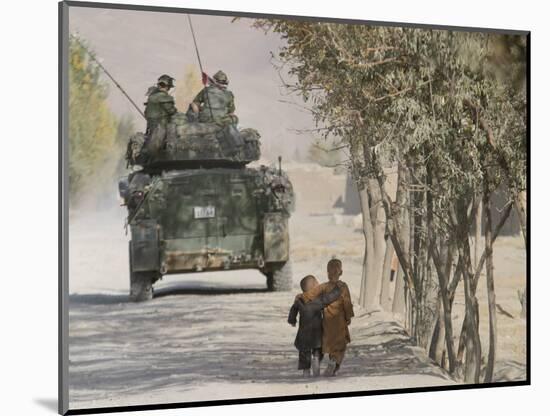 Afghan Boys Walk Along a Path While International Security Assistance Force (Isaf)-null-Mounted Photographic Print