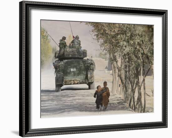 Afghan Boys Walk Along a Path While International Security Assistance Force (Isaf)-null-Framed Photographic Print