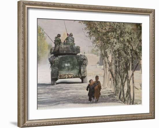 Afghan Boys Walk Along a Path While International Security Assistance Force (Isaf)-null-Framed Photographic Print
