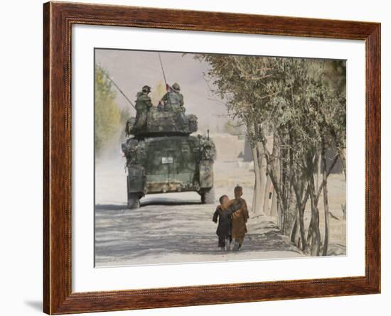 Afghan Boys Walk Along a Path While International Security Assistance Force (Isaf)-null-Framed Photographic Print