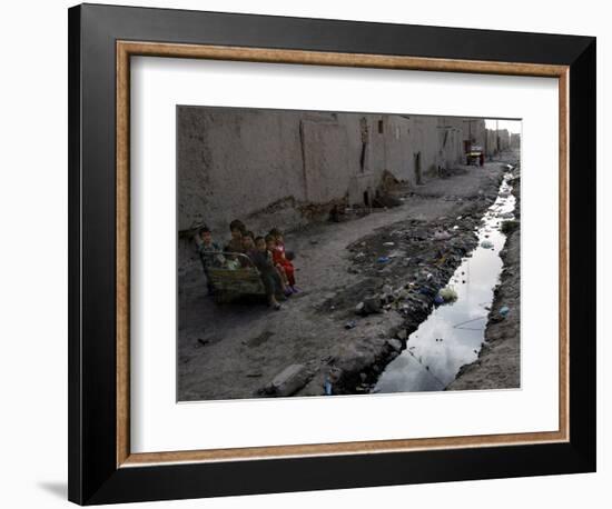 Afghan Children Sit Together Aboard an Old Cart-null-Framed Photographic Print