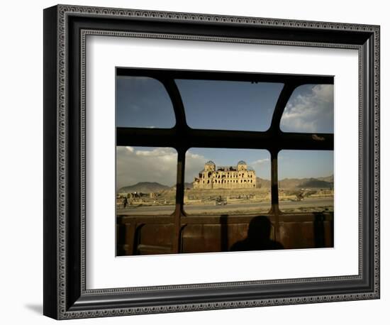 Afghan Drives Past the Darul Aman's Palace in the City of Kabul, Afghanistan--Framed Photographic Print