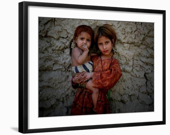 Afghan Girl Holds Her Younger Sister in Nangarhar Province, East of Kabul, Afghanistan-null-Framed Photographic Print