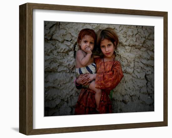 Afghan Girl Holds Her Younger Sister in Nangarhar Province, East of Kabul, Afghanistan-null-Framed Photographic Print