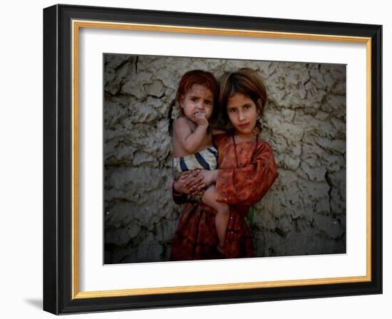 Afghan Girl Holds Her Younger Sister in Nangarhar Province, East of Kabul, Afghanistan-null-Framed Photographic Print